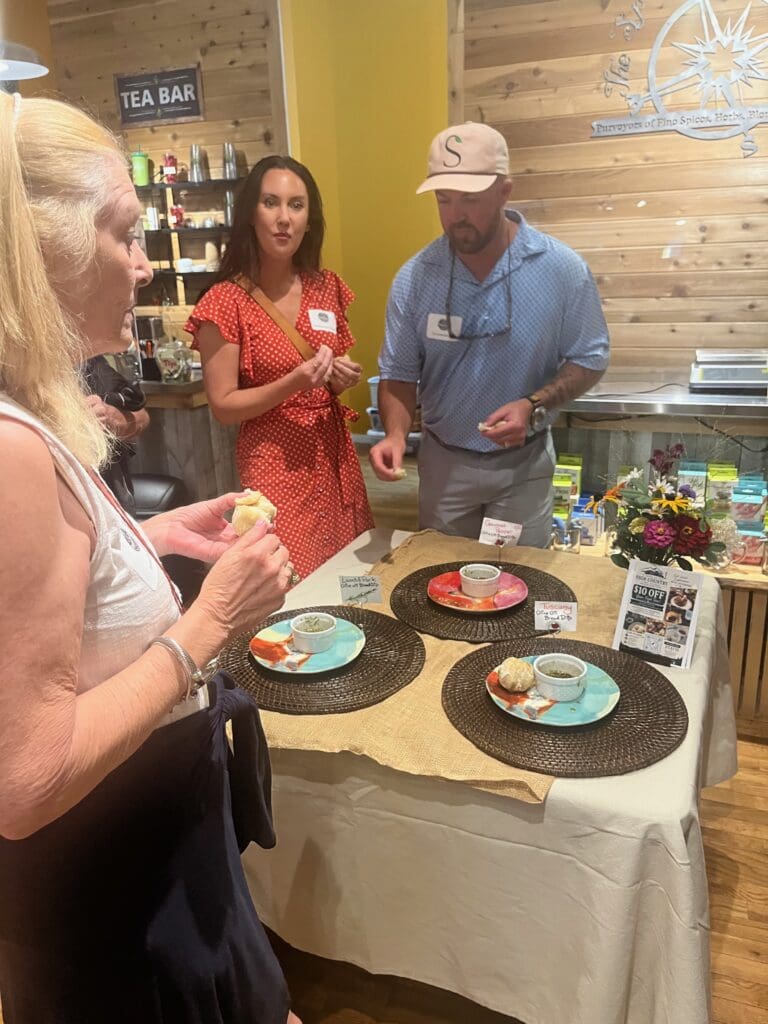 Guests sampling bread and oil dips